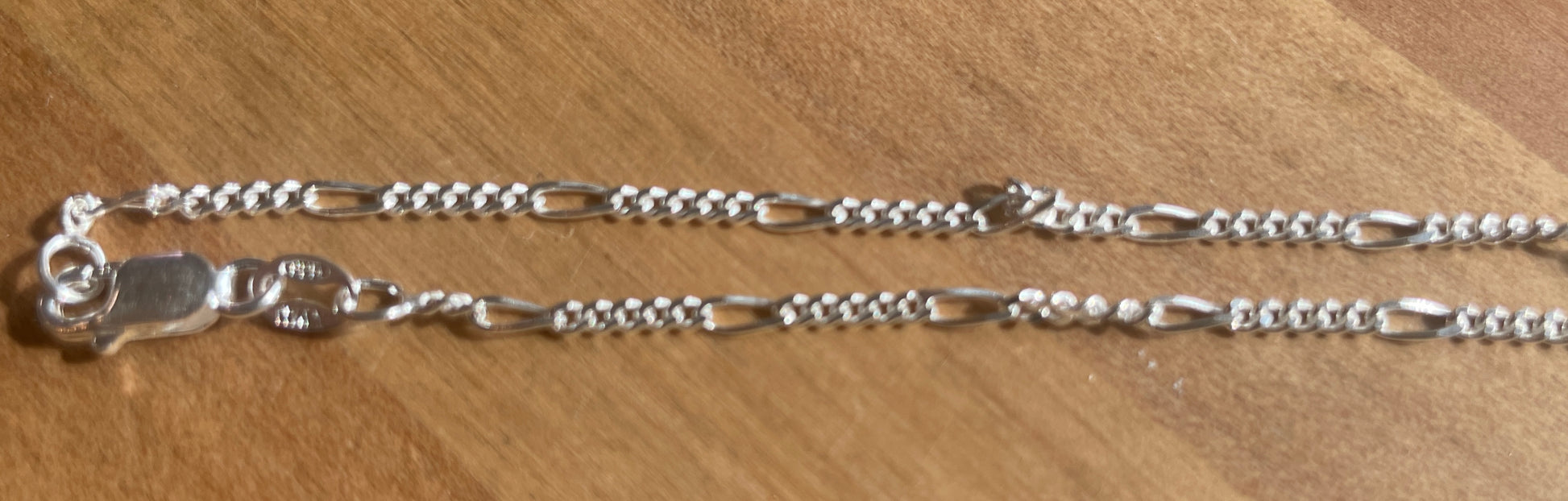 1.8mm DMND cut figaro sterling silver chain. 18" length.  Made in Italy.